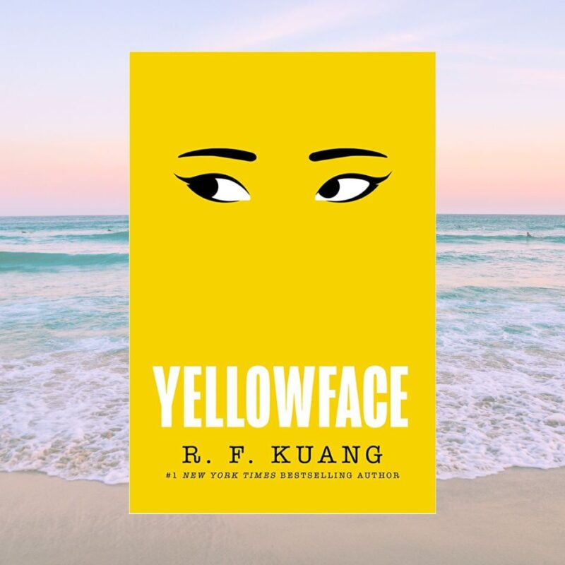 The cover of Yellowface by R.F. Kuang is on the backdrop of a beach as a summer reading recommendation. 