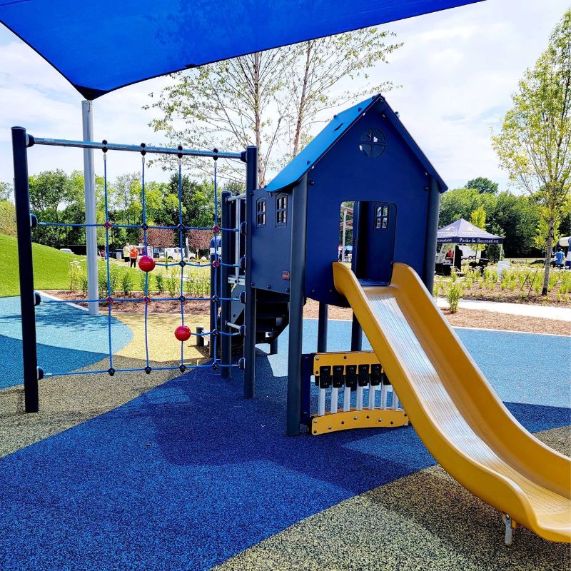 playground equipment with slide and rope ladder wall